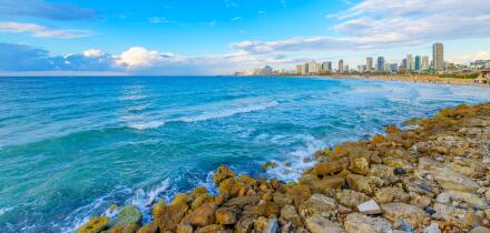View of the coastal city skyline and beaches of Tel Aviv, Israel, from the ancient city of Jaffa, along the Mediterranean Sea.