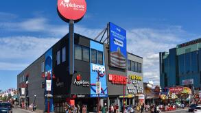Niagara Falls, Canada - August 13, 2022: Applebee's, IHOP, Bennihaha and Fun Zone Laser Tag on Clifton Hill, a popular tourist destination.
