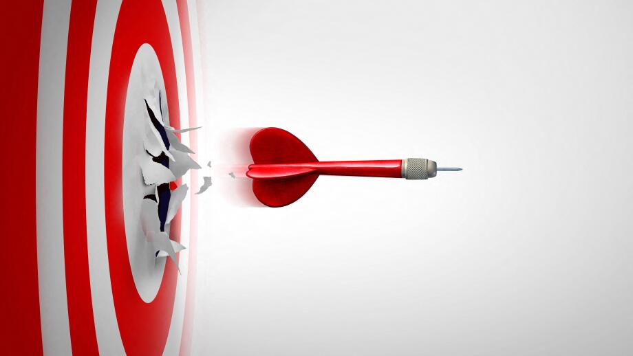 Setting New Goals and Breaking through or overcoming challenges as a dart representing entrepreneurship and unlimited business success focus blasting