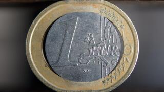 ILLUSTRATION - This illustration shows a damaged euro coin in a vise in Stuttgart, Germany, 15 December 2011. Photo: Michele Danze
