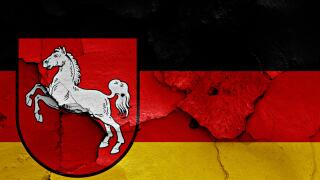 flags of Lower Saxony and Germany painted on cracked wall. Image shot 05/2016. Exact date unknown.