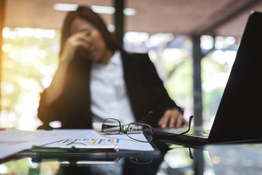 Businesswoman get stressed and headache while having a problem a