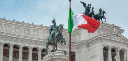 Italy flag city landmark, view of the national flag of Italy sited at the Vittorio Emanuele Monument in the historic centre of Rome, Italy