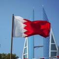 The national flag of Bahrain and Bahrain World Trade Centre.f
