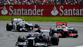 08.07.2012 Towcester, England. Pastor Maldonado of Venezuela and Williams F1 Team and Lewis Hamilton of Britain and Vodafone McLaren Mercedes in action during the Race at the Santander British Grand Prix, Round 9 of the 2012 FIA Formula 1 World Championsh