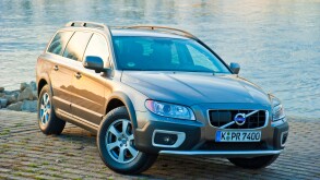 Front and side view of Volvo XC 70 four wheel drive station waggon in sunset parked in front of Rhine river. Image shot 2009. Exact date unknown.