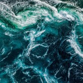 Abstract background. Waves of water of the river and the sea mee