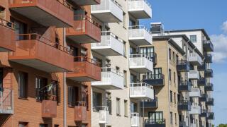 Red and white apartment blocks with many balconies in Berlin, Germany, Europe