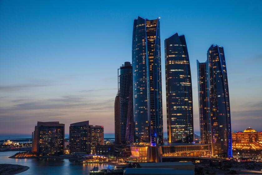 View of Etihad Towers and to the right The Emirates Palace Hotel, Abu Dhabi, United Arab Emirates, Middle East