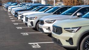 New Volvo vehicles lined up for sale at a dealership