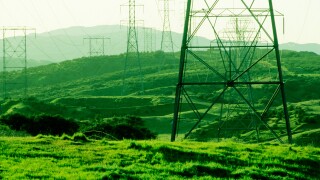 power poles Powerlines stretch over a southern california hillside