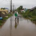 A man wades through a flooded street ahead of the forecasted arrival of Hurricane Melissa in Old Harbour, Jamaica, Monday, Oct. 27, 2025. (AP Photo/Matias Delacroix)
