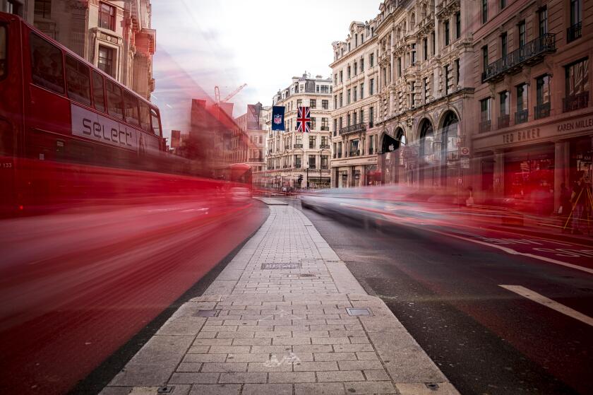 Regent Street in London with blur of traffic. HDR.