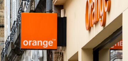 Orange shop sign in Bayonne, France