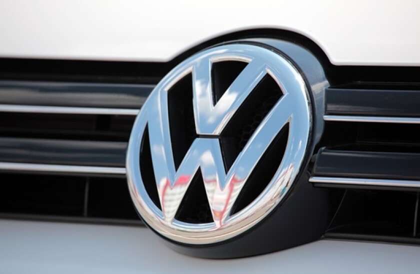 Close-up Volkswagen emblem on a Golf 6 (Mk VI) car.