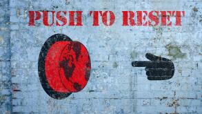 Push to reset world graffiti on grungy wall, the great reset concept