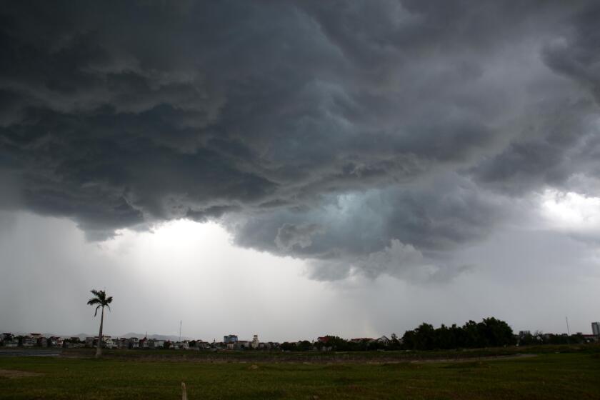 Dark storm clouds over Ha Tinh, Vietnam, as a lightning storm approaches