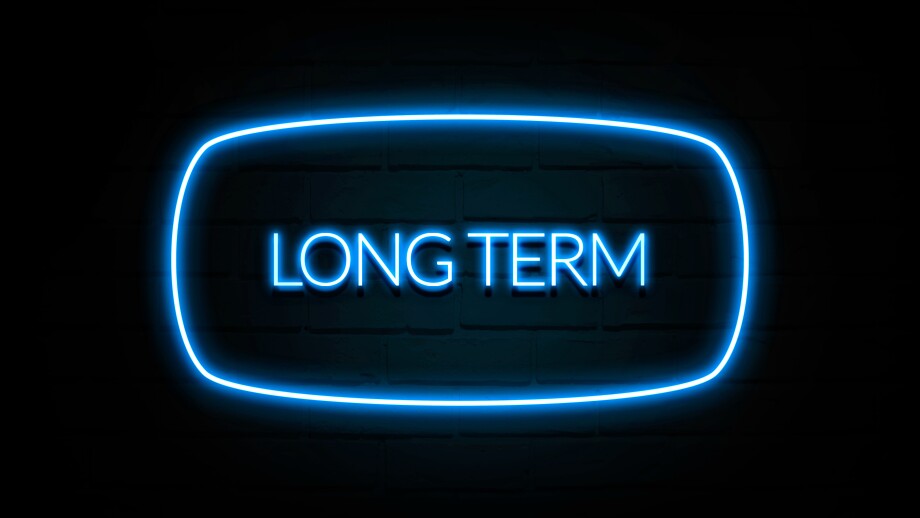 Long Term  - colorful Neon Sign on brickwall