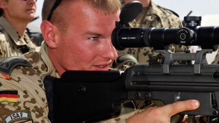 A German soldier assigned to the International Security Assistance Force (ISAF), holds a G3A3ZF rifle with a Hensoldt 4x24 opti