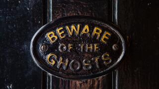 A Beware of the Ghosts plaque on the entrance to the Golden Fleece public house in York, England. It is regarded to be the most