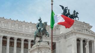 Italy flag city landmark, view of the national flag of Italy sited at the Vittorio Emanuele Monument in the historic centre of Rome, Italy