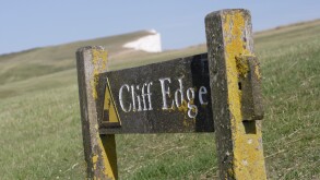 Cliff Edge sign on Beachy head coastline East Sussex England UK