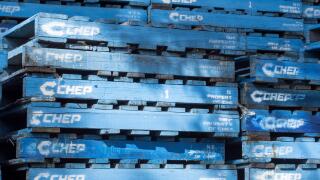 Stacked blue Chep pallets, a subsidiary of the Australian company Brambles, in a yard waiting to be collected in Australia