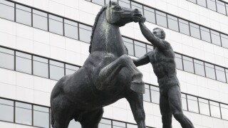 Statue in front of the BCP Millenium bank headquarters in Porto, Portugal