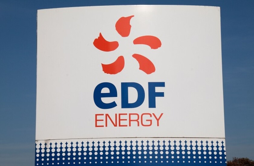 The EDF Energy logo on a sign outside its offices beside Heathrow Airport, London, UK.