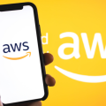 Amazon Web Services logo on the smartphone screen.