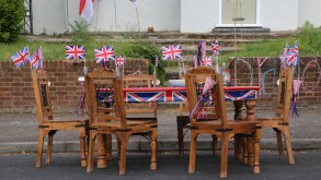 Wooden Table And Chairs Decorated With Union Jack Flags Ready For Street Party Celebrating The Queen's Diamond Jubilee