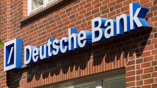 Stade, Germany - May 28, 2020: Signage on brick wall at Deutsche Bank branch . Deutsche Bank is a global Multinational Investment bank and financial s