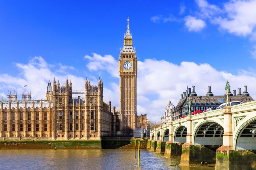 London, United Kingdom. The Palace of Westminster, Big Ben, and Westminster Bridge at sunrise.