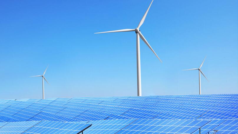 Solar panels and wind turbines in field. Concept of eco friendly thechnologies