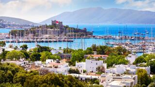View of Bodrum castle and Marina Harbor in Aegean sea in Turkey