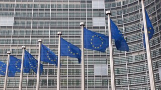 European Union flags in front of the Berlaymont building of the European Commission in Brussels, Belgium
