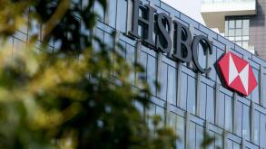 A logo sign outside of a facility occupied by HSBC Bank in Milan, Italy on September 3, 2016.
