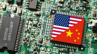 Flags of China and the US are displayed on the microchip on a PC Motherboard.