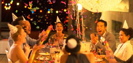Friends throwing confetti at birthday party