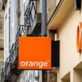 Orange shop sign in Bayonne, France