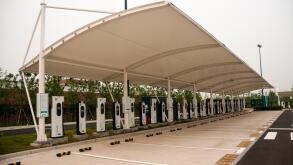 Parking spots at an EV charging station, number 4 car park Shanghai Disneyland, China.