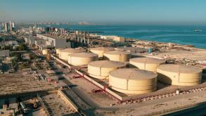 Middle East water and gas containers along the coastline for gas, water and oil concepts. Industrial zone.