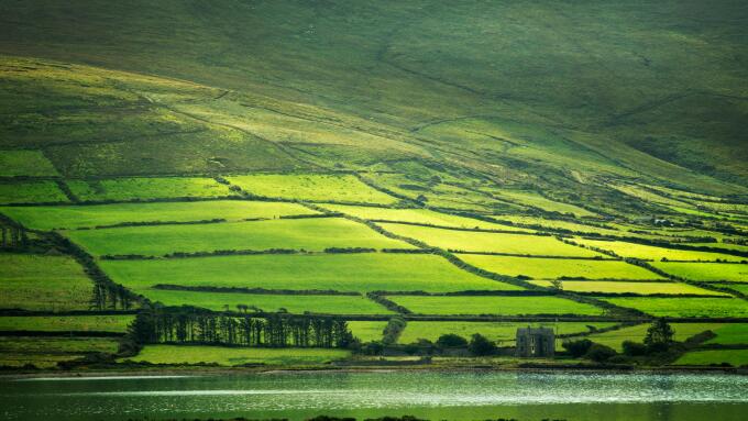 Green fields on the Ring of Kerry as seen from Valentia Island, Ireland