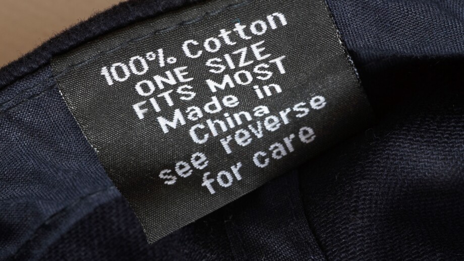 100% cotton one size fits most made in China see reverse for care label in navy blue baseball cap - sold in the UK United Kingdom, Great Britain