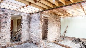 Renovation of an old brick house, brick walls and timber floor frame