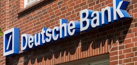 Stade, Germany - May 28, 2020: Signage on brick wall at Deutsche Bank branch . Deutsche Bank is a global Multinational Investment bank and financial s