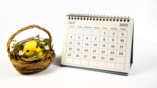 April 2022 calendar and yellow Easter chicken