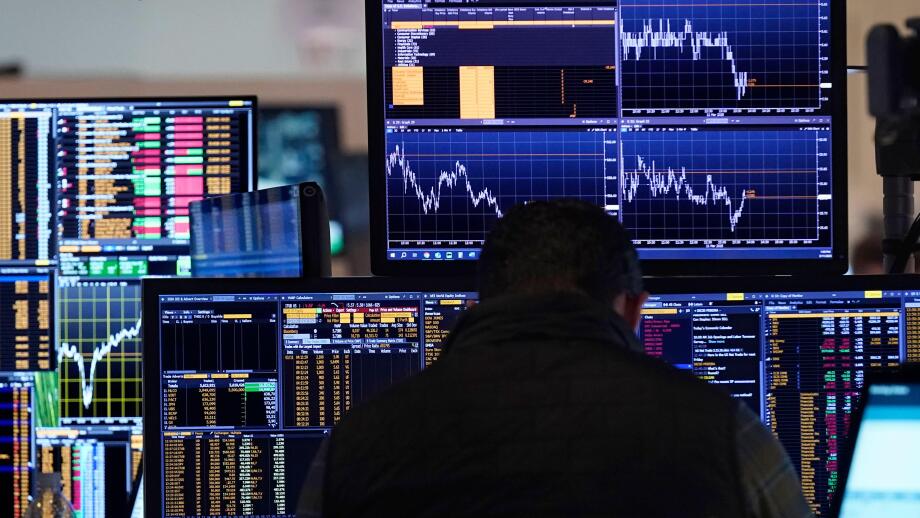 A trader works on the floor of the New York Stock Exchange, Tuesday, March 11, 2025. (AP Photo/Richard Drew)
