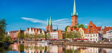 Historic skyline along the Trave river in the old town of Lubeck, Germany on a summer day