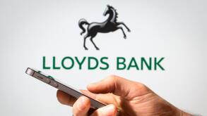 A man using Lloyds Bank online banking on his mobile phone